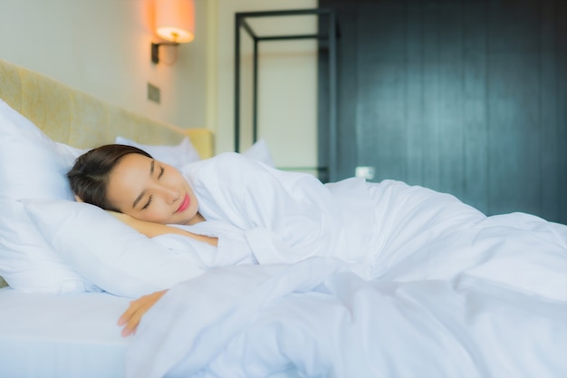 Portrait beautiful young asian woman sleep on bed with pillow and blanket
