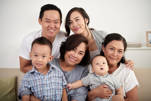 Free photo happy asian family posing together