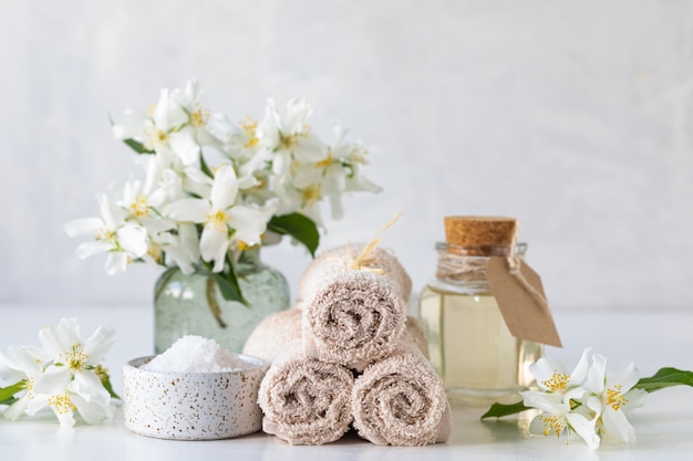 Free photo spa concept of jasmine oil, with bath salt and flowers