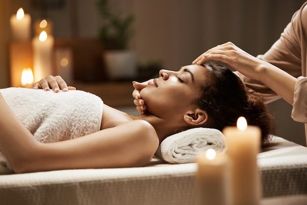 Free photo attractive african woman enjoying face massage in spa salon.